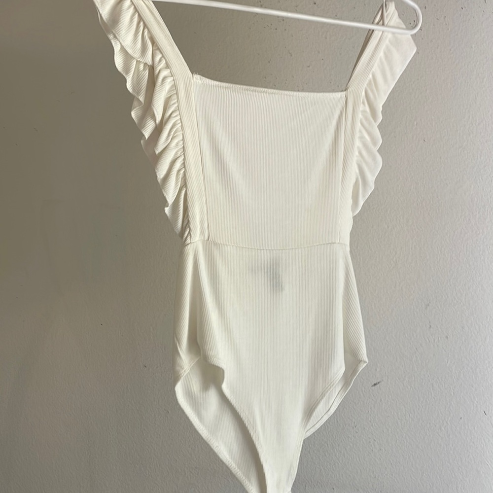 Amazing white one piece with low back